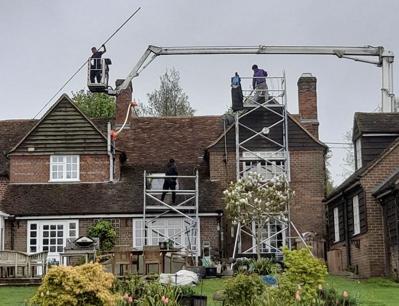 The Roof Moss Cleaners using cherry picker and scaffolding to clean roof safely and professionally in Hemel Hempstead, Hertfordshire