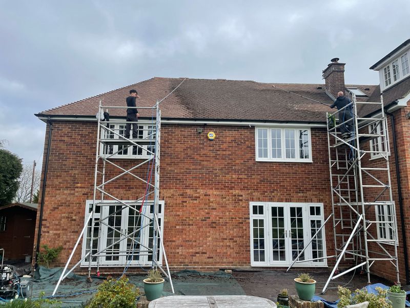 Roof cleaning carried out safely from scaffold towers by The Roof Moss Cleaners in Hemel Hempstead